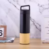 Vacuum bottle with wooden base