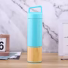Vacuum bottle with wooden base